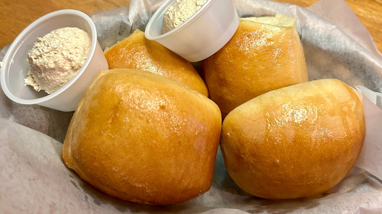 4 Texas Roadhouse rolls with cinnamon honey butter