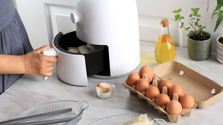 carton of eggs next to air fryer