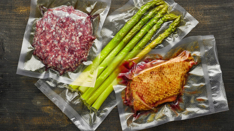 Vacuum-sealed meat and asparagus