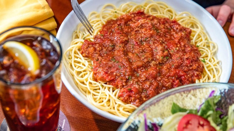 Pasta with red sauce and drink