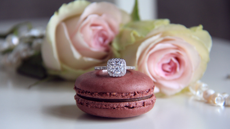macaron with wedding ring on it