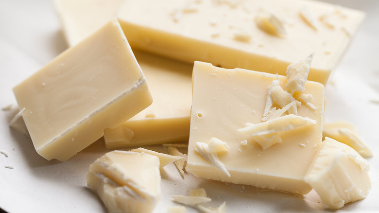closeup of a broken bar of white chocolate