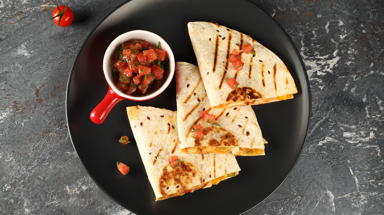 Quesadilla with salsa on plate