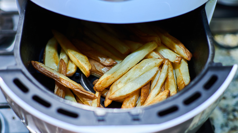 Fries in an air fryer basket