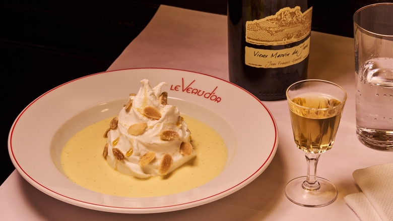 Creamy dessert and a glass of wine at Le Veau d'Or