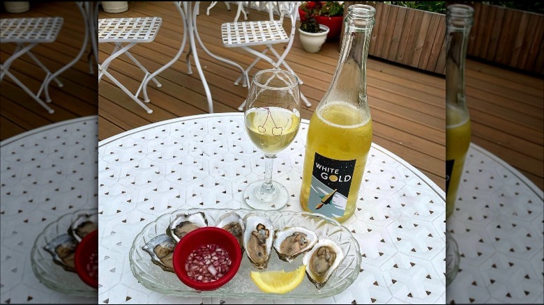 wine and oysters on table