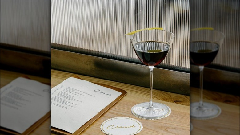 Claud  menu and wine glass