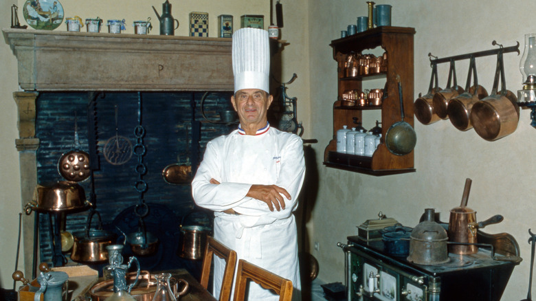 Chef Paul Bocuse standing in kitchen