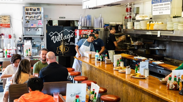 People eating at Village Coffee Shop