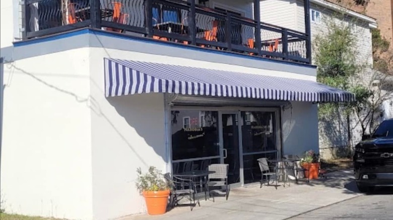 Exterior of Narobia's Grits & Gravy with a blue and white awning