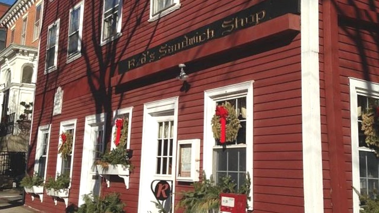 Exterior of Red's Sandwich Shop, with red wooden panelling