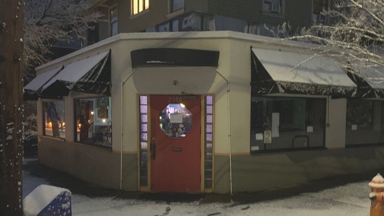 Outside The Stepping Stone Cafe in winter, with snow on the awnings