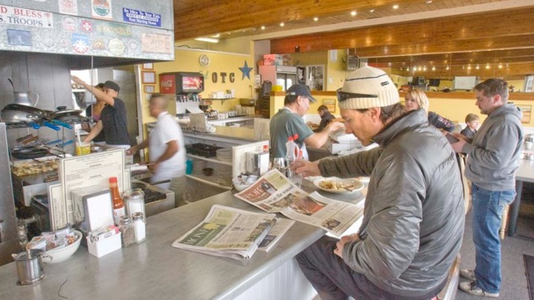 People sittingat the counter in the Over the Counter Cafe