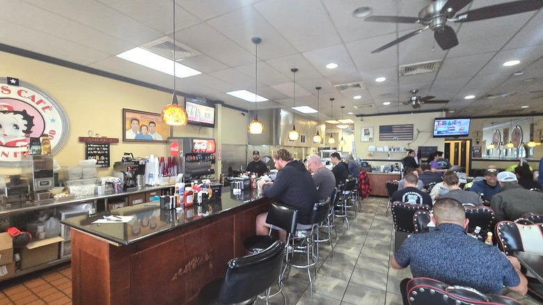 Inside Joe's Cafe, with nearly every seat taken by people eating breakfast