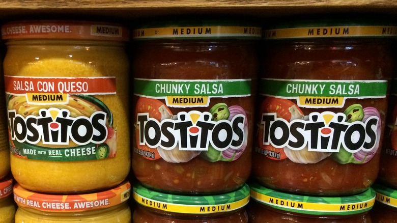 Jars of Tostitos salsa on store shelf