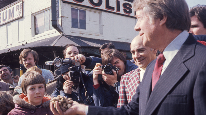 Jimmy Carter holding peanuts