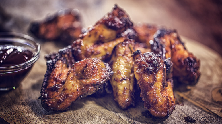 BBQ chicken on a wooden board