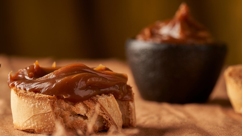 Cajeta sauce on pastry bowl in background