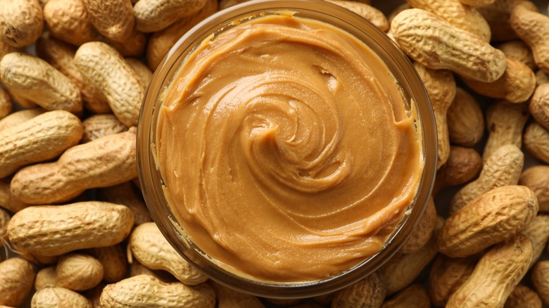 Peanut butter surrounded by peanuts