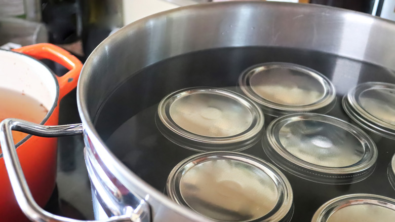 canning jars in hot water