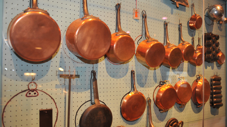 Julia Child's kitchen on display at The Smithsonian museum showcasing her wall of copper pots and pans
