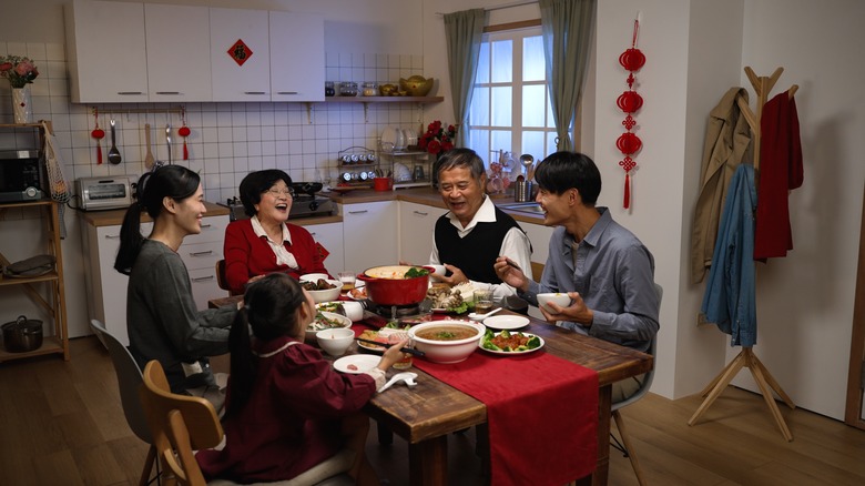 People sitting around dining table
