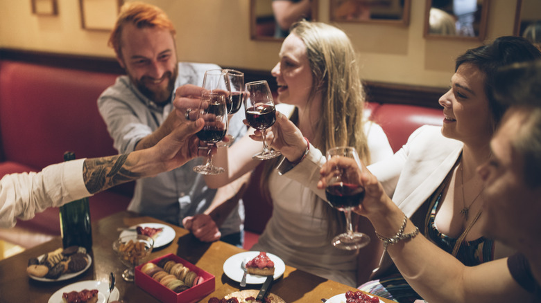 People toasting over table