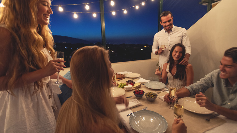 People gathered around dining table