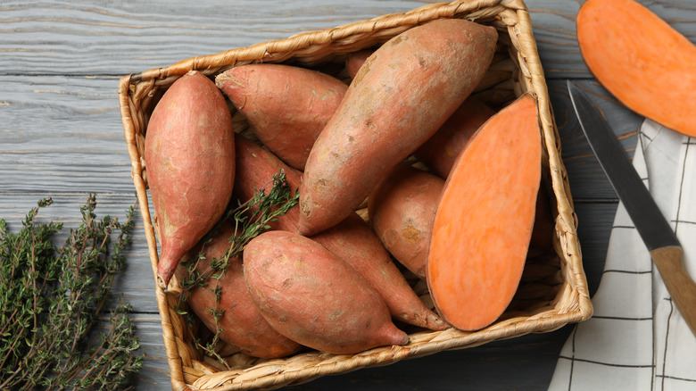 Wicker basket holding sweet potatoes