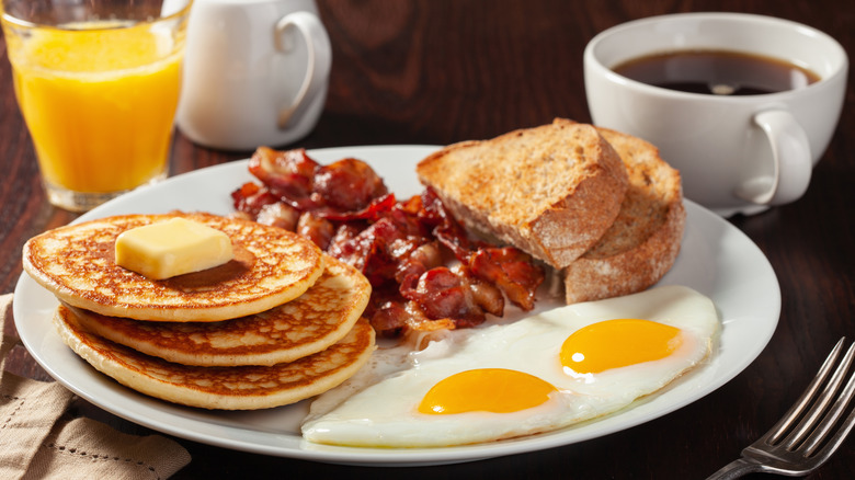 Pancakes, eggs, bacon, and toast