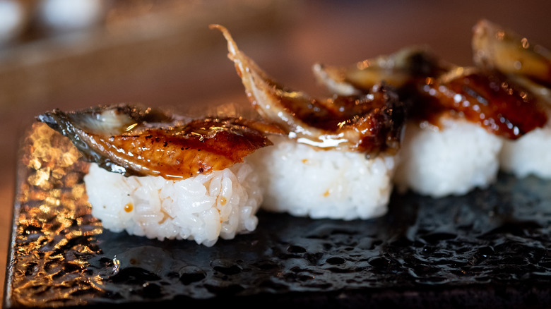 nigiri sushi on black plate