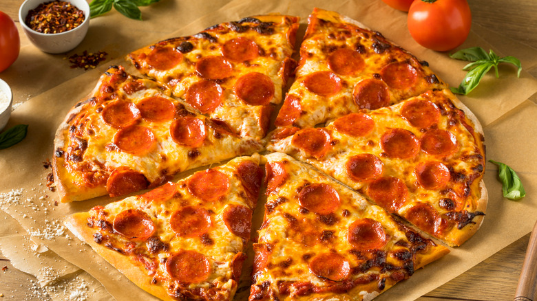 Greasy, six-sliced, pepperoni pizza