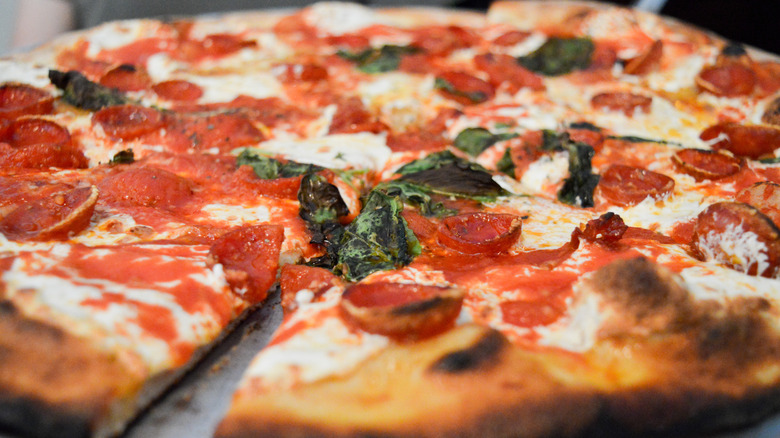 pizza with pepperoni and basil