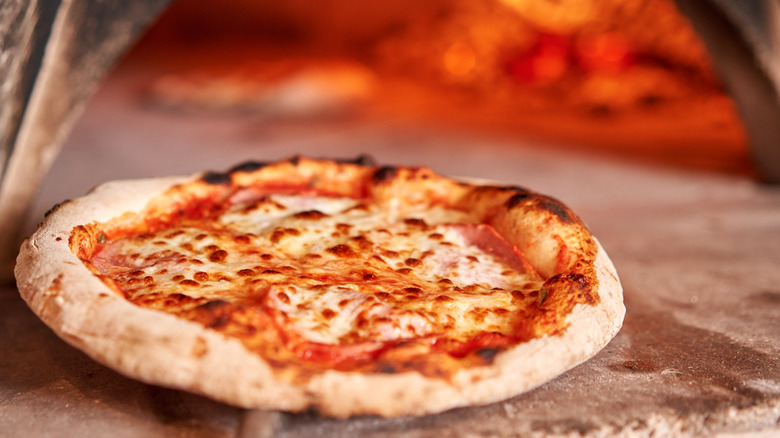 Fresh, coal-fired cooked pizza