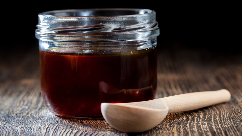 Dark buckwheat honey in glass jar