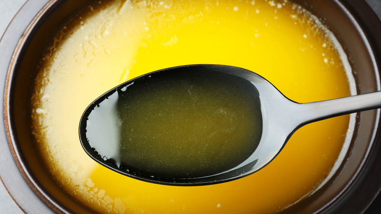 Spooning clarified butter bowl
