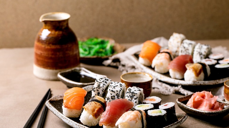 bottle of sake with sushi