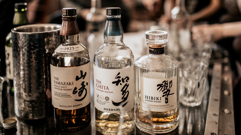 three bottles of Suntory whisky