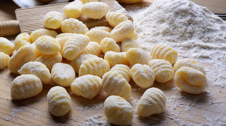 raw gnocchi and flour