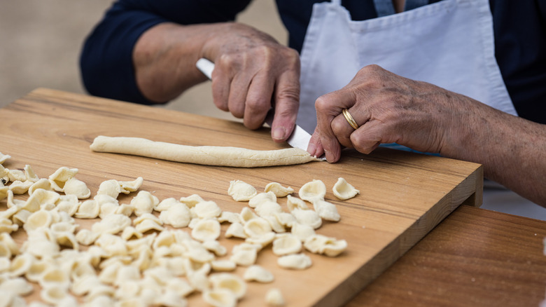cook making orechiette pasta