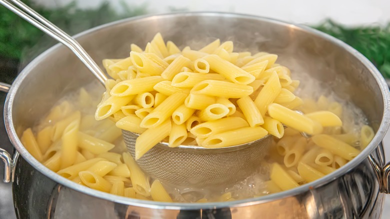 penne cooking in pot