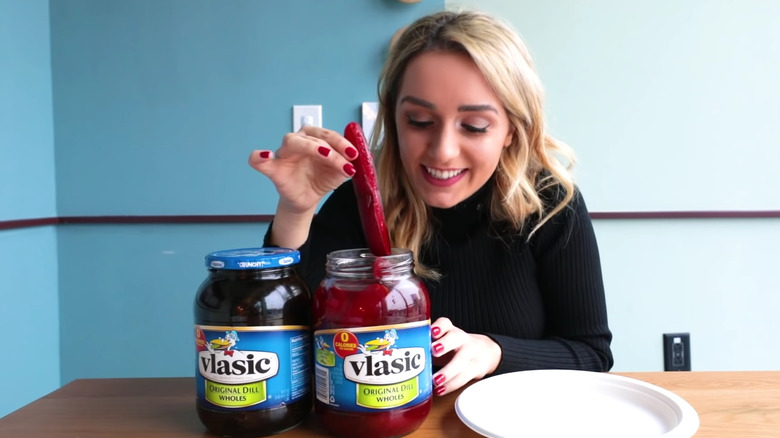 A woman eating Kool-Aid pickles