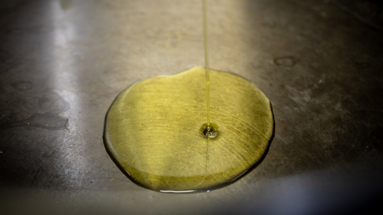 Oil being poured into pan