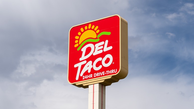 Del Taco sign against a blue sky