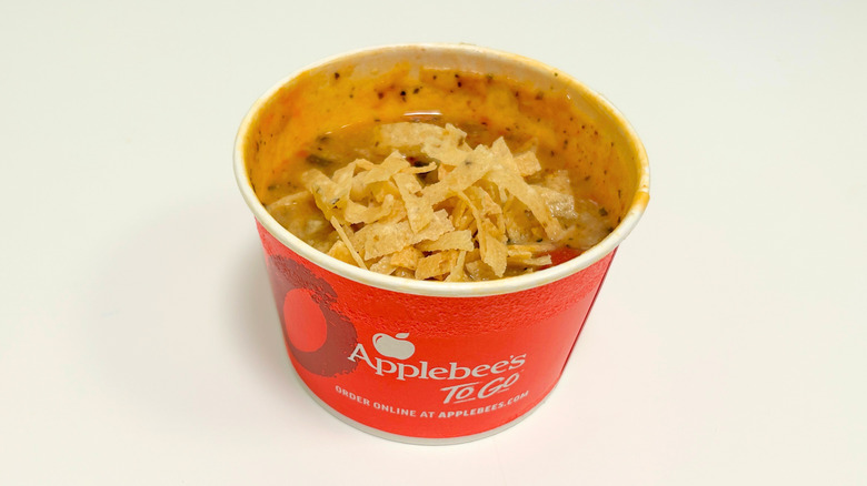 A to-go container of Applebee's Chicken Tortilla Soup