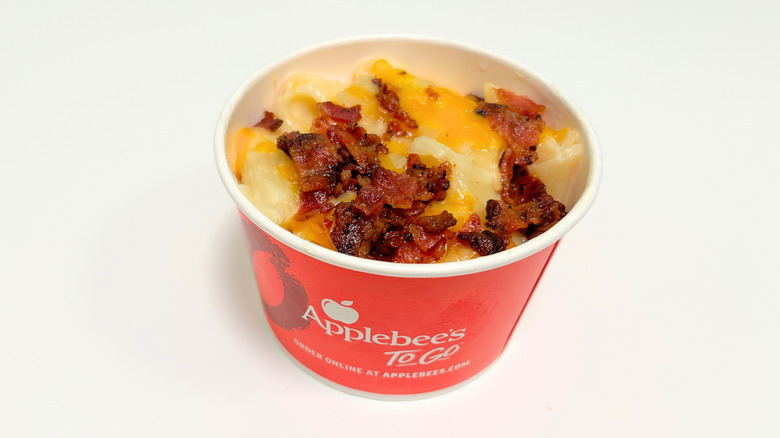 A to-go container of Applebee's Macaroni and Cheese