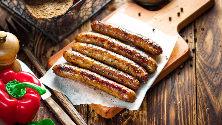 Sausages on a wooden cutting board
