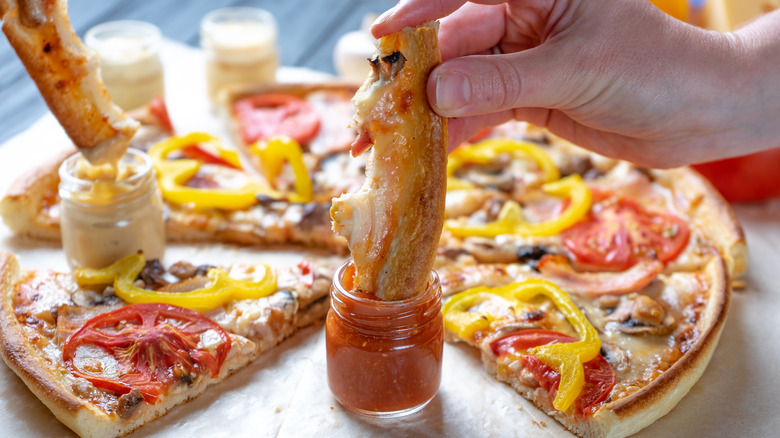 Pizza crust dipped in sauces
