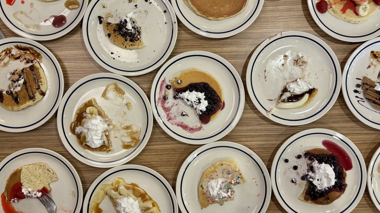 IHOP pancake types lined up on plates on table