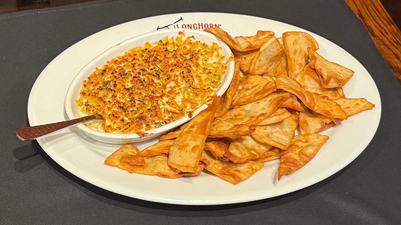 LongHorn Steakhouse's Parmesan Crusted Spinach Dip on black napkin